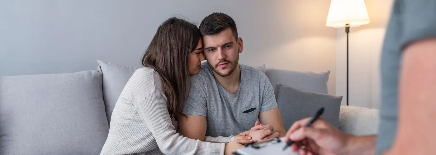 Couple engaged in constructive communication during therapy session