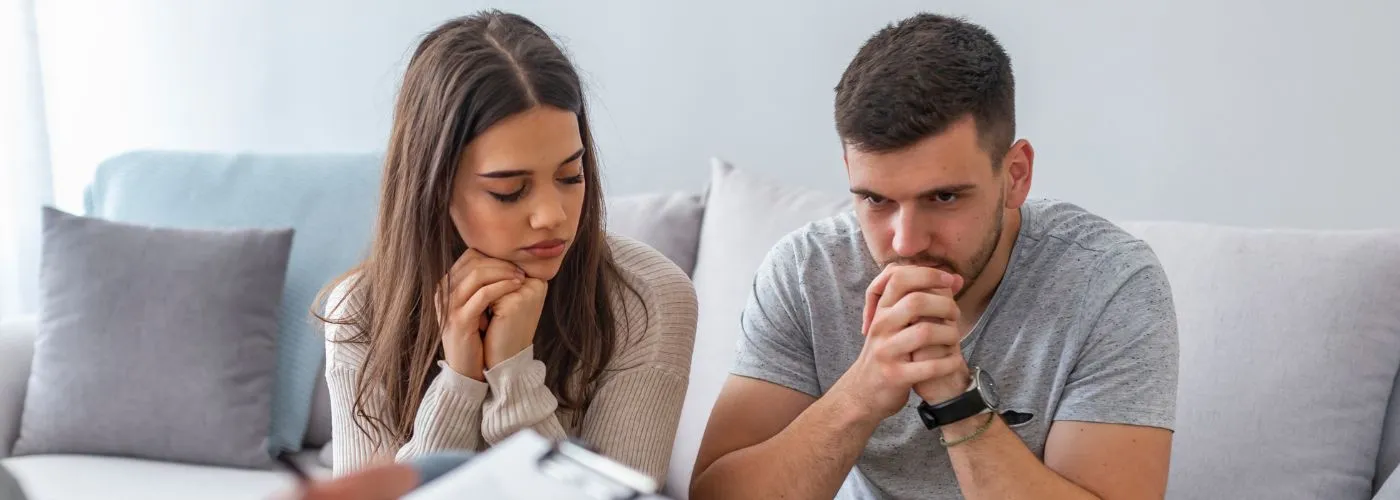 Married couple working through relationship challenges with professional guidance