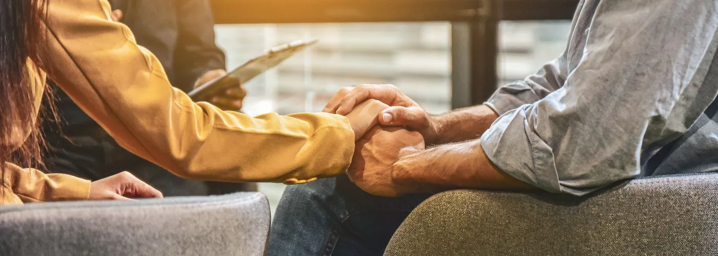 Married couple building stronger partnership through marriage counseling