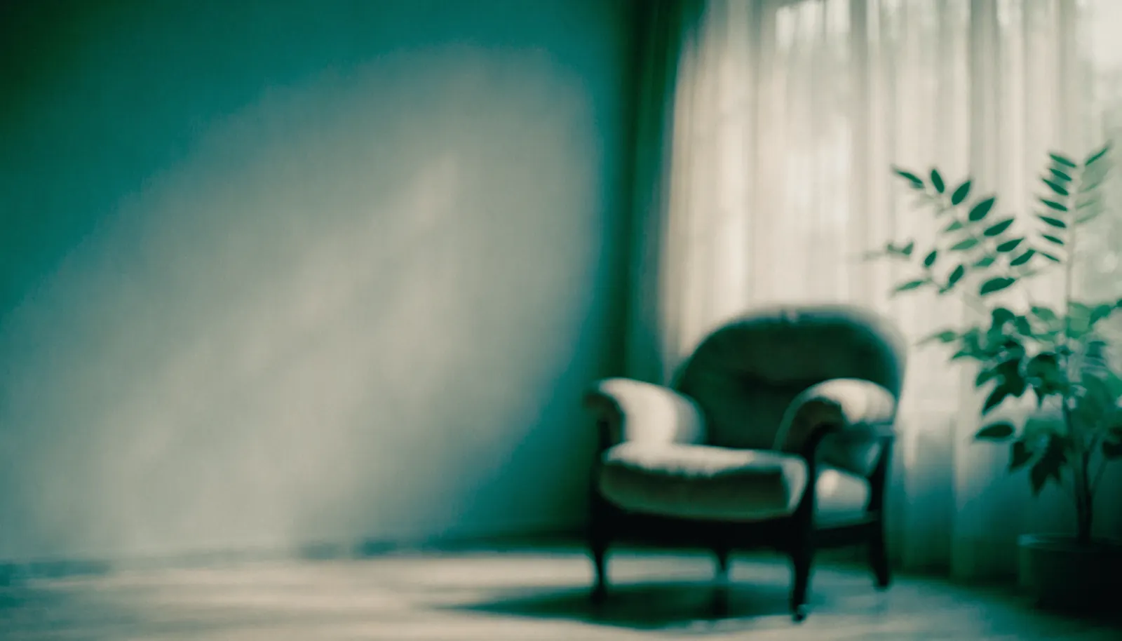 Calm therapy room with a soft armchair by a sunlit window
