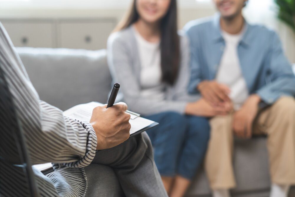 Couples Therapy. Couple in therapy session. Happy and smiling.