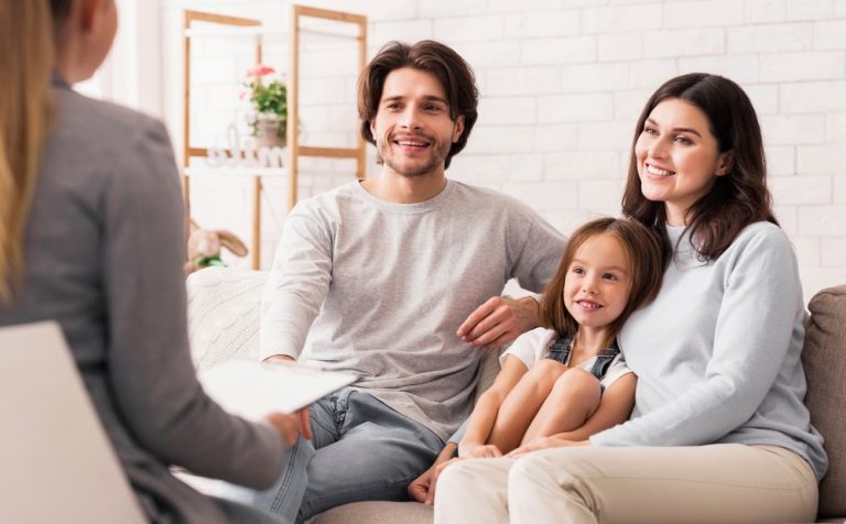 Family Therapy. A family having a therapy session with child.