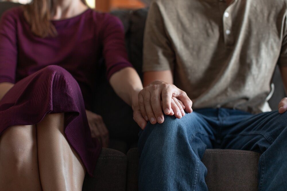 Couples Therapy. Man and woman holding hands.